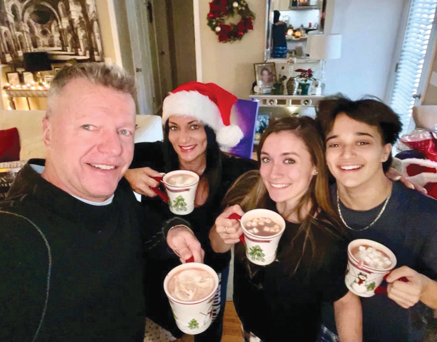 Olivia Passaretti posed for a photo with her sister Victoria, mother and stepfather on Christmas 2021.